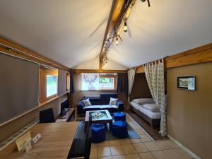 a living room with a couch and a table at Verena's Parkhotel in Löffingen