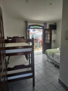 Voodi või voodid majutusasutuse Pousada Caravelas - Centro de Paraty toas