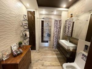a bathroom with a sink and a toilet at Chata pod strzechą w Beskidach Agroturystyka in Bierna +47 photos