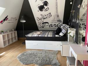 a room with a bed and a desk in a room at Chata pod strzechą w Beskidach in Bierna +42 photos