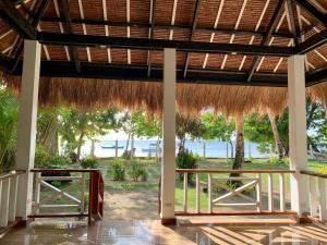 a view of the beach from the pavilion of a resort at Pore's Homestay in General Luna