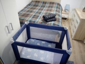 a small bedroom with a bunk bed with a small bed at The Staithe by the Canal. in Lancaster