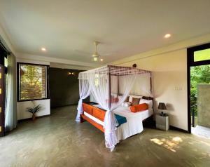 En eller flere senge i et værelse på My Home Villa