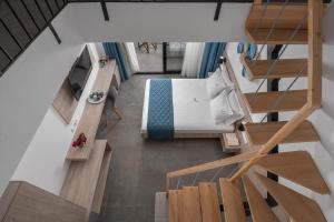 Postel nebo postele na pokoji v ubytování Dandelion Suites