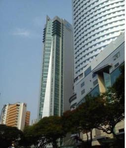 a tall building in the middle of a city at Premiera Hotel Kuala Lumpur in Kuala Lumpur