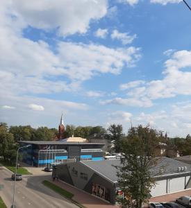 a view of a building with a church and a street at IR Apartment in Rēzekne