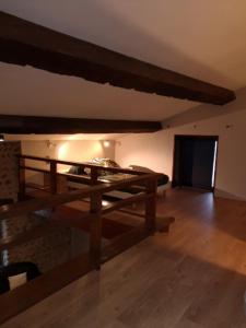 a room with a wooden table in a room at Maison Pérouges spa in Pérouges