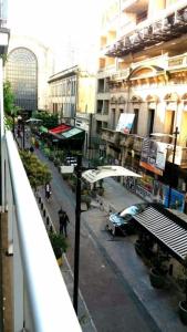 a view of a street from a balcony of a building at Carlos Gardel Tango Studio in Buenos Aires