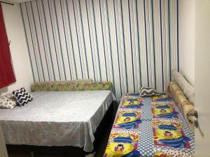 Voodi või voodid majutusasutuse Excelente apartamento na Praia Grande, todo mobiliado, móveis todos novos , não tem como não gostar toas