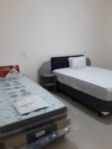 En eller flere senge i et værelse på Paraiso de Aruanã - Rio Araguaia - Imóvel recém construído!! NOVÍSSIMO!!!! A PISCINA É AQUECIDA!!!
