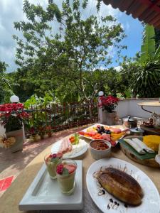 a table with a buffet of food on it at Olho D'Água Pousada in Guaramiranga
