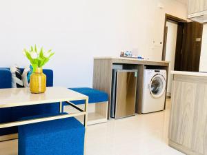 a living room with a washer and a washing machine at Aurora Western Village in Ho Chi Minh City