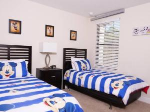 Ένα ή περισσότερα κρεβάτια σε δωμάτιο στο Beautiful Villa at Champions Gate +30 φωτογραφίες