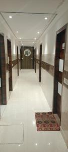 
a large room with a stairway leading to a hallway at Hotel Dakha International Karol Bagh Newly Modified in New Delhi
