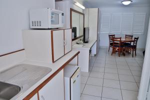 Kuchyň nebo kuchyňský kout v ubytování Central Park Motel