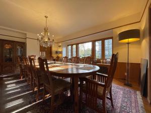 a dining room with a table and chairs at Cecil Bacon Manor in Seattle