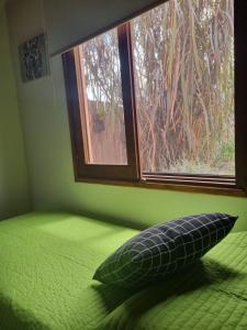 Un pat sau paturi într-o cameră la ROSALIMON