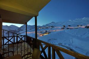 a balcony with a view of a snowy mountain at 2-room Apartment NFT Gudauri Penta 701 in Gudauri