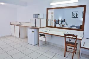 Kuchyň nebo kuchyňský kout v ubytování Central Park Motel