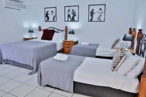 Postel nebo postele na pokoji v ubytování Central Park Motel