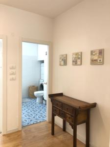 a bathroom with a wooden table and a toilet at SUCASA RA’ANANA in Ra‘ananna +36 photos