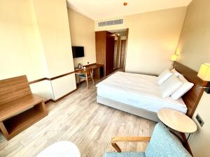Postel nebo postele na pokoji v ubytování Türkmen Riverside Hotel Adana