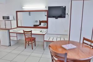 Kuchyň nebo kuchyňský kout v ubytování Central Park Motel