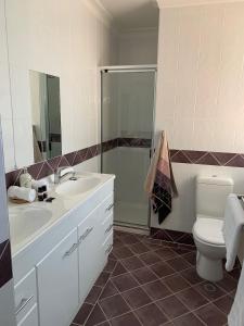 a bathroom with a sink and a toilet at Avon Terrace Guest House in York