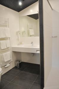 Koupelna v ubytování Garni Hotel Alber