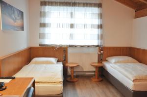 Postel nebo postele na pokoji v ubytování Garni Hotel Alber