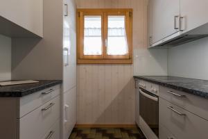 Kuchyň nebo kuchyňský kout v ubytování Chalet Sunnegga
