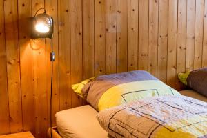 Postel nebo postele na pokoji v ubytování Chalet Sunnegga