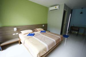 Postel nebo postele na pokoji v ubytování Phumi Resort