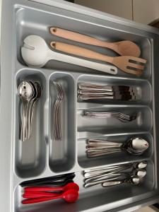 a refrigerator filled with silver utensils and utensils at LaDIGo „Kleines Glück“ in Goslar