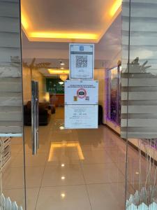 a lobby of a building with a sign on the wall at SBS HOTEL in Padang Besar