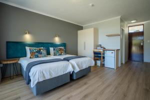 Postel nebo postele na pokoji v ubytování Fairy Knowe Hotel