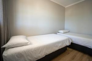 Postel nebo postele na pokoji v ubytování Fairy Knowe Hotel