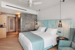 Posteľ alebo postele v izbe v ubytovaní BIO BEACH Boutique Hotel - Adults Only