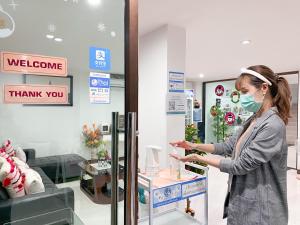 a woman wearing a face mask in a store at Rinn Boutique House in Chiang Mai