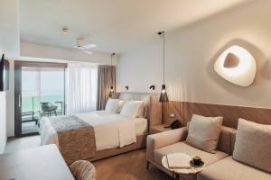 Posteľ alebo postele v izbe v ubytovaní BIO BEACH Boutique Hotel - Adults Only