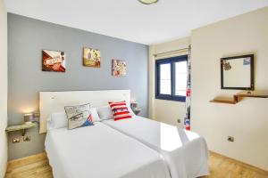 Posteľ alebo postele v izbe v ubytovaní Casa Puerto del Tostón