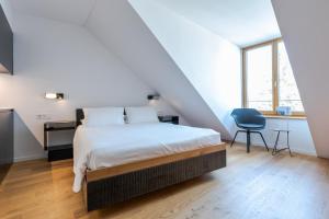Krevet ili kreveti u jedinici u okviru objekta SET Hotel.Residence by Teufelhof Basel