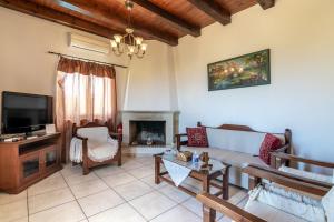 a living room with a couch and a fireplace at Marni in Gállos