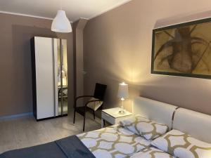 Posteľ alebo postele v izbe v ubytovaní Apartament Grafitowy Willa Laser