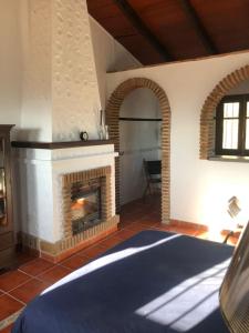 a living room with a fireplace in a house at Mijas Pueblo paradise villa in Málaga