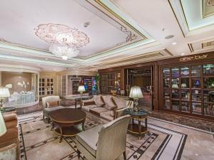 a living room with a couch and a table at Elite World Istanbul Florya in Istanbul