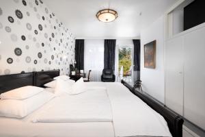 Postel nebo postele na pokoji v ubytování Design-Boutique Hotel Vosteen