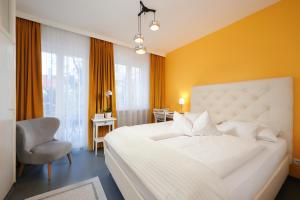 Postel nebo postele na pokoji v ubytování Design-Boutique Hotel Vosteen