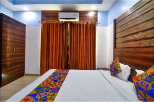 FabHotel Ocean View Apartment - Nr Dabolim Airport客房内的一张或多张床位