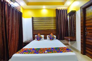 FabHotel Ocean View Apartment - Nr Dabolim Airport客房内的一张或多张床位